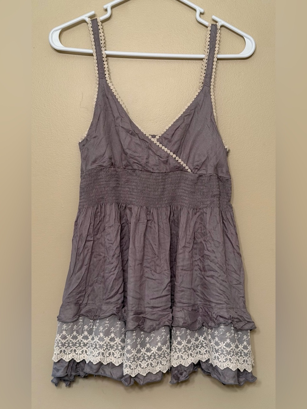 Grey babydoll tank top with lace layer and tiered ruffle bottom